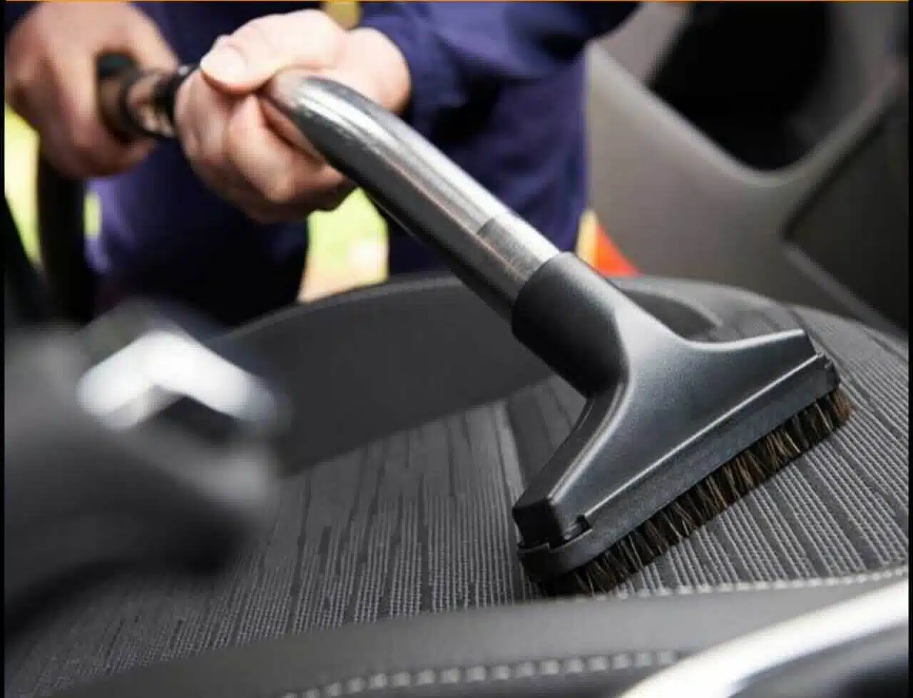 Complete car interior vacuuming and upholstery cleaning service