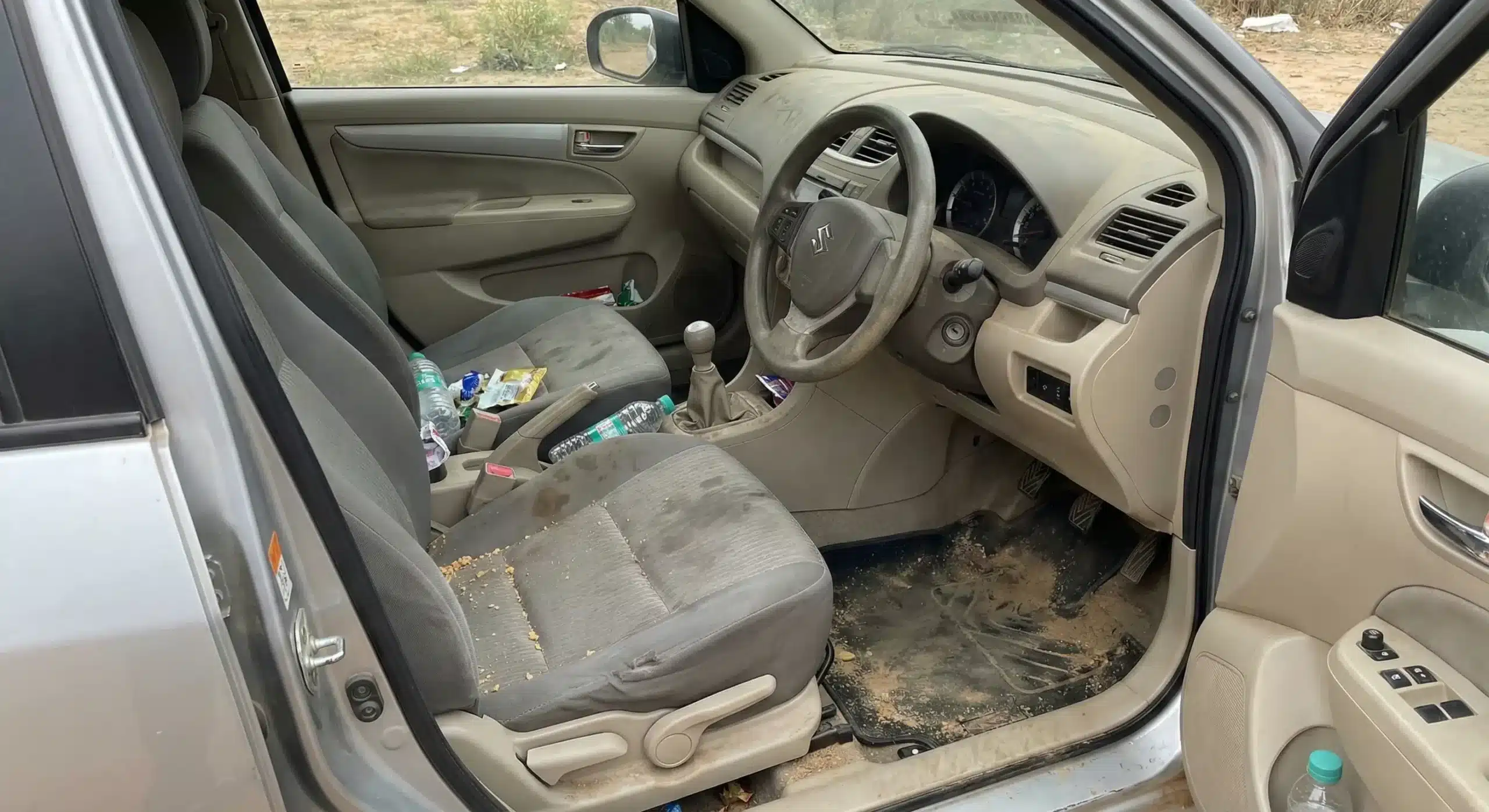 Car upholstery with stains before cleaning service in Chennai